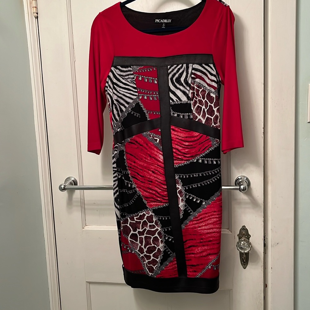 Mixed print sheath dress with faux leather trim.